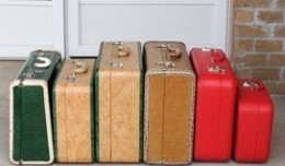 Green vintage suitcase, isolated on white