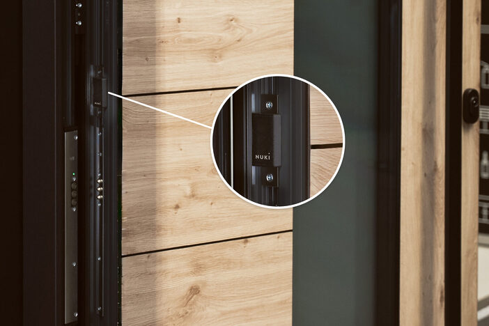 nuki smart module integrated into electromechanical door close up